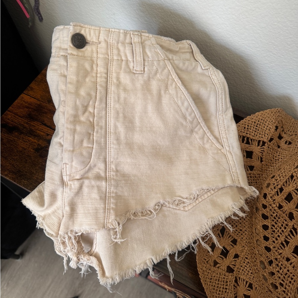 Free People Frayed High-Rise Jean Shorts in Cream.